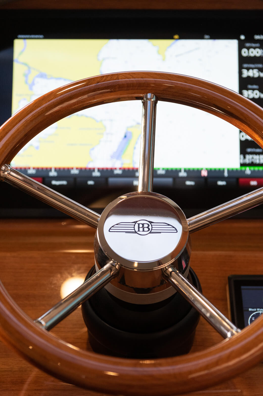 A beautiful photo of a Palm Beach Motor Yacht steering wheel in Sydney.